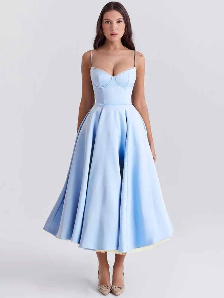 Blue A-line dress with slight stretch, mid-calf length, and spaghetti straps. Features a strapless neckline and zipper closure.