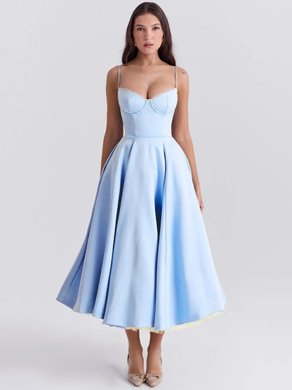 Blue A-line dress with slight stretch, mid-calf length, and spaghetti straps. Features a strapless neckline and zipper closure.