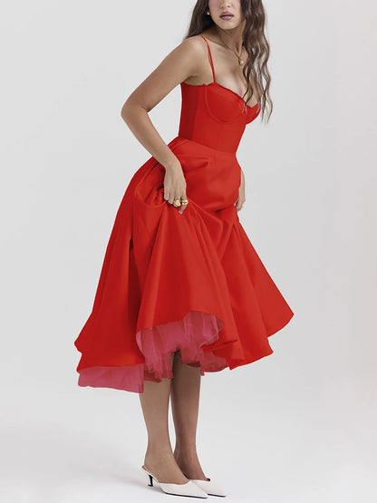 Red A-line dress with slight stretch, mid-calf length, and spaghetti straps. Features a strapless neckline and zipper closure.