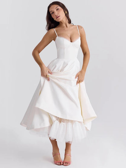 White A-line dress with slight stretch, mid-calf length, and spaghetti straps. Features a strapless neckline and zipper closure.